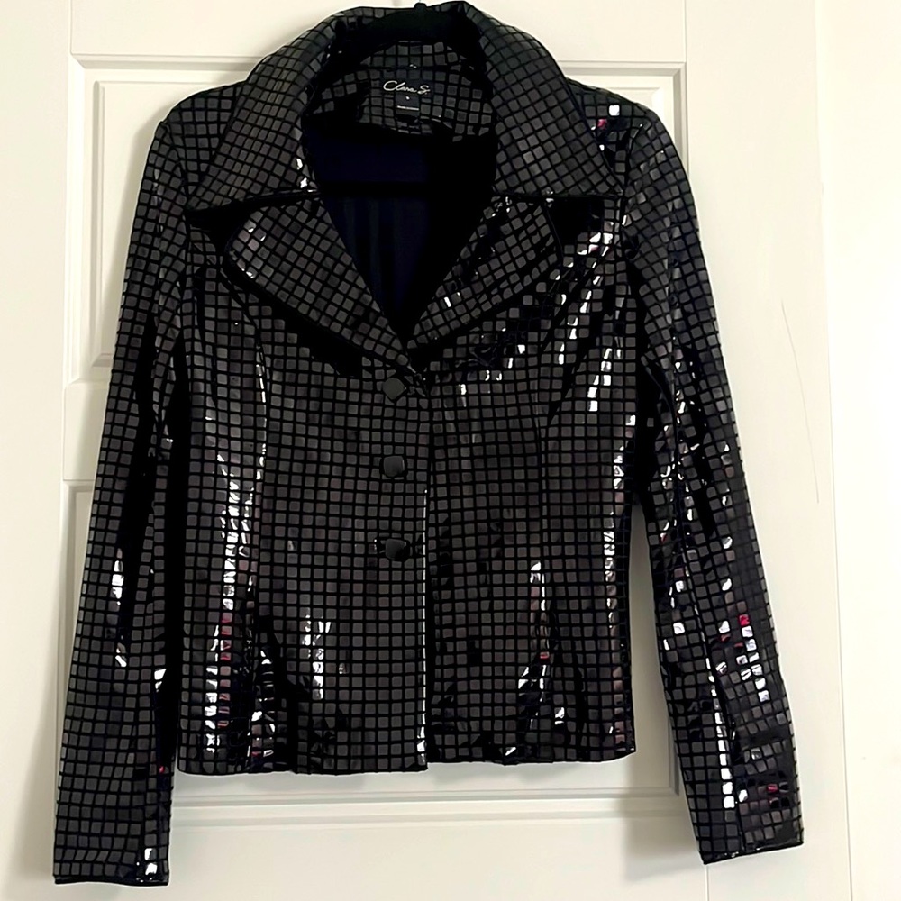 Black painted jacket with square details and square buttons.